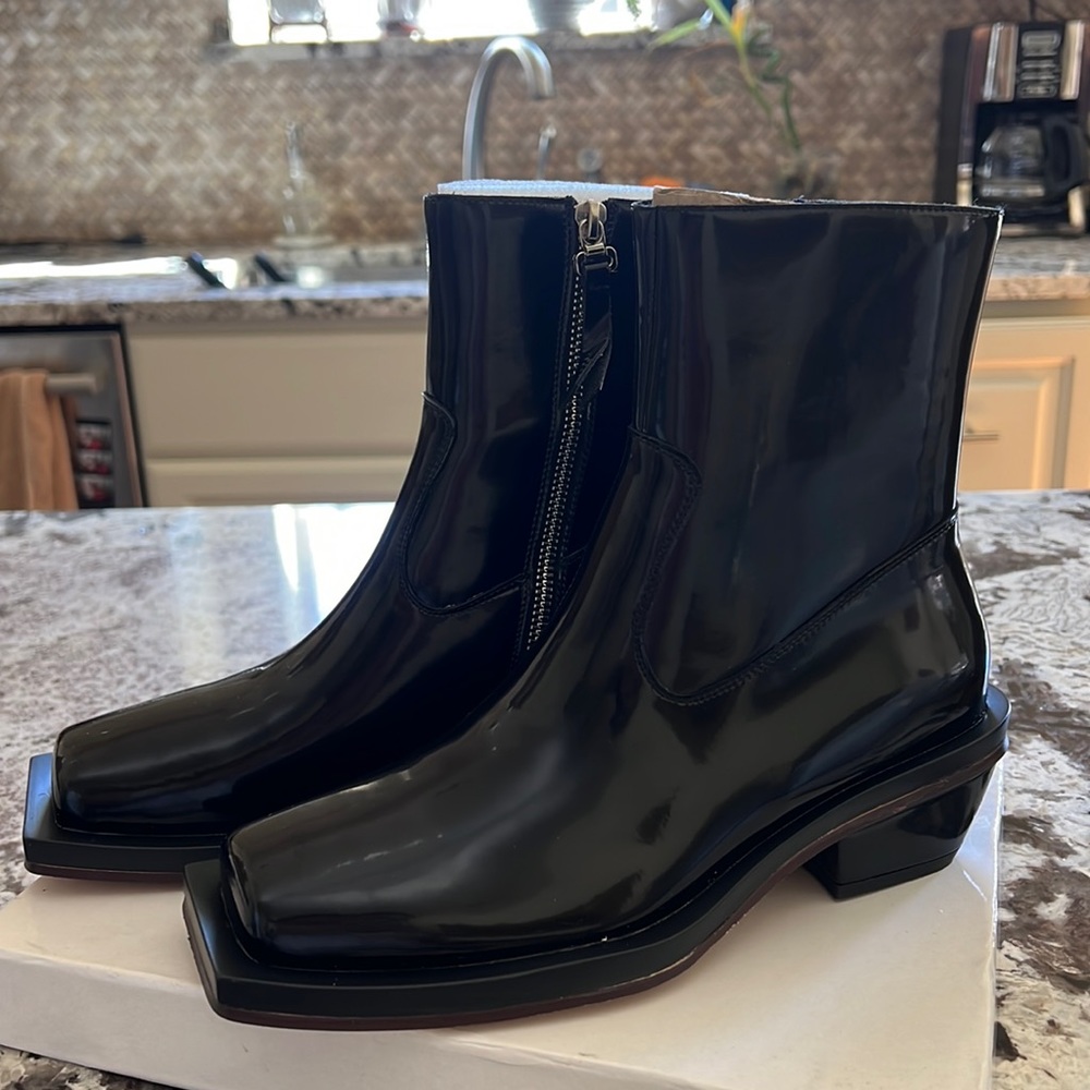 Brand new never worn black boots.